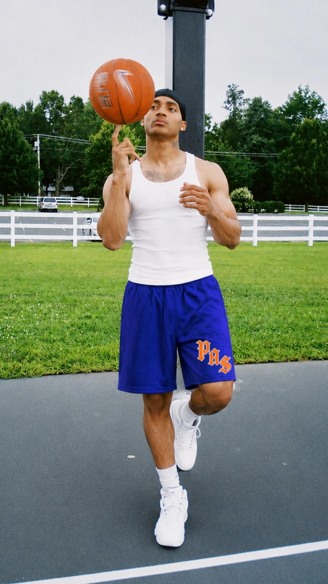 White tank with blue basketball shorts