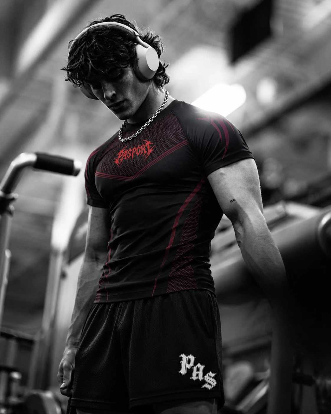 Black and red compression top with black mesh shorts